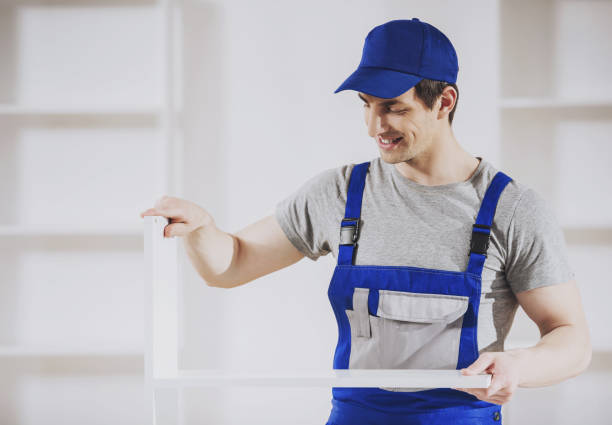istock Young Worker Installing Furniture in New Home. 994645984