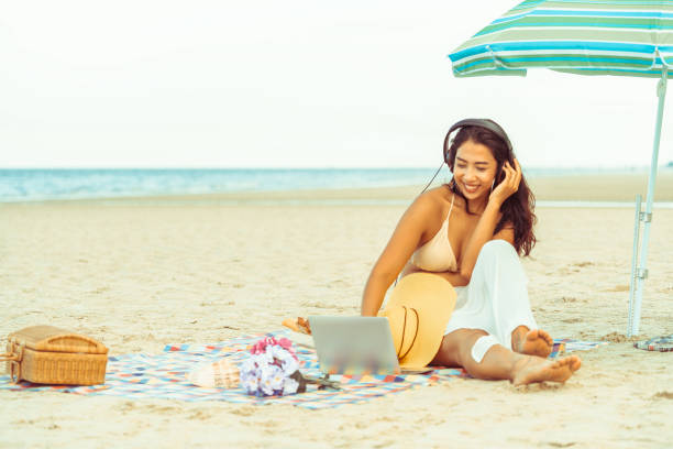 istock Plus size young woman sitting on the beach. 994646220