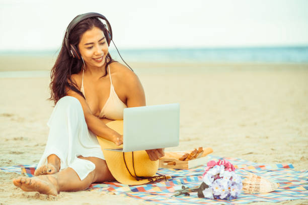 istock Plus size young woman sitting on the beach. 994646228