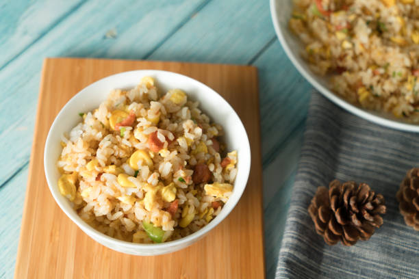 istock Egg Fried rice with a blue wood grain background 994672756