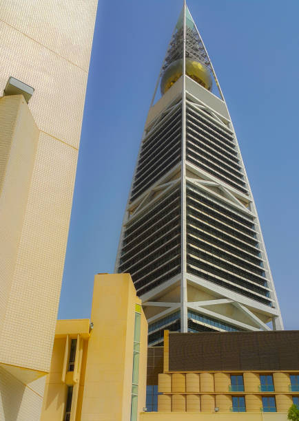 istock Riyadh / Saudi Arabia - August 19, ?2015: Al-Faisaliyah Center Tower amidst a blue cloudless sky. The buildings houses malls, offices, galleries, hotels and restaurants. 994707936
