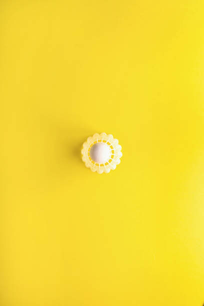 istock Shuttlecock for playing badminton on a yellow background. Minimalism. Concept summer razlecheny 994713370