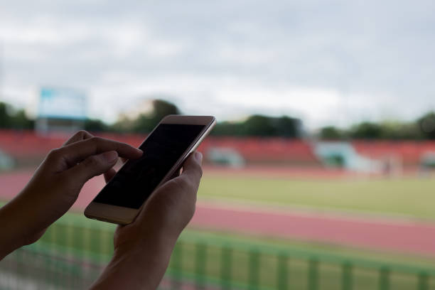 Using smartphone for communications at football stadium