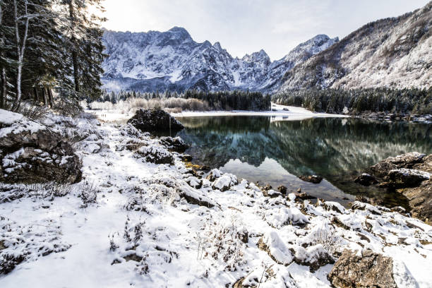 istock first snow at the mountain lake 994730842