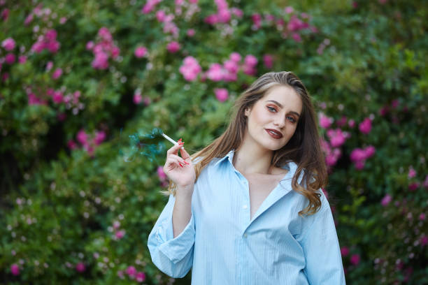 istock Young woman smoking outdoor 994741022