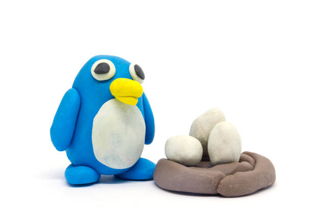istock Play dough Penguin father and son on white background 994748402