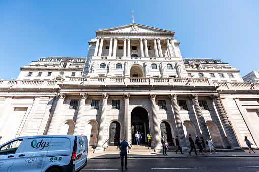 London, UK - June 26, 2018: Bank of England wide angle exterior architecture with people walking in center of downtown financial district city