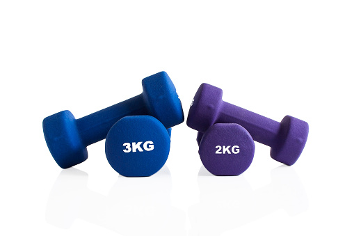 2kg and 3kg dumbbells workout weights isolated on a white background.