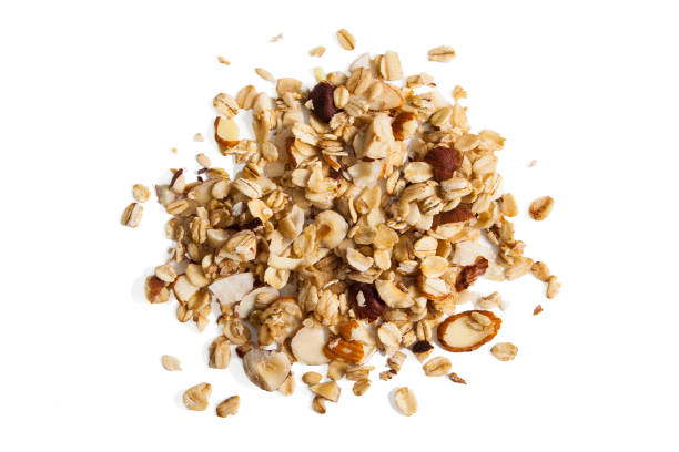 Granola from above Pile of granola from above isolated on a white background. granola photos stock pictures, royalty-free photos & images