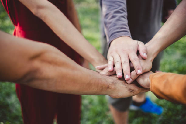istock Stacking hands of young teen student, teamwork, togetherness and cooperation concept 994750912
