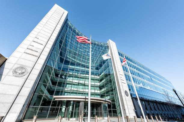 US United States Securities and Exchange Commission SEC entrance architecture modern building sign, entrance, american flag, looking up sky, glass windows reflection Washington DC, USA - January 13, 2018: US United States Securities and Exchange Commission SEC entrance architecture modern building sign, entrance, american flag, looking up sky, glass windows reflection exchanging stock pictures, royalty-free photos & images