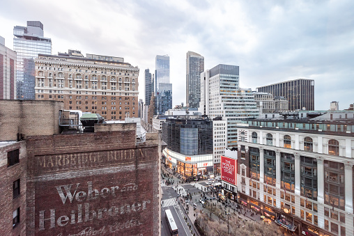 New York City, USA - April 6, 2018: View of urban cityscape, skyline, rooftop building skyscrapers in NYC Herald Square Midtown with Macy's store, construction, aerial