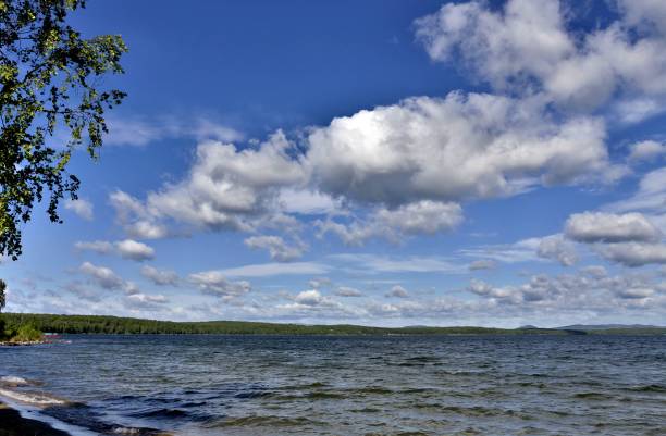 istock blue sky with clouds over the lake 994783828