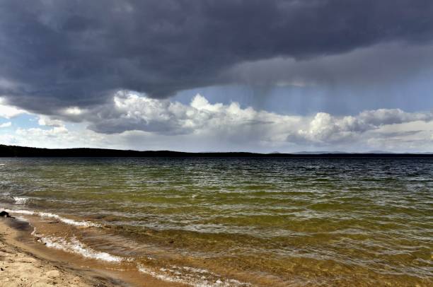 istock dark gray sky over the restless lake 994783930