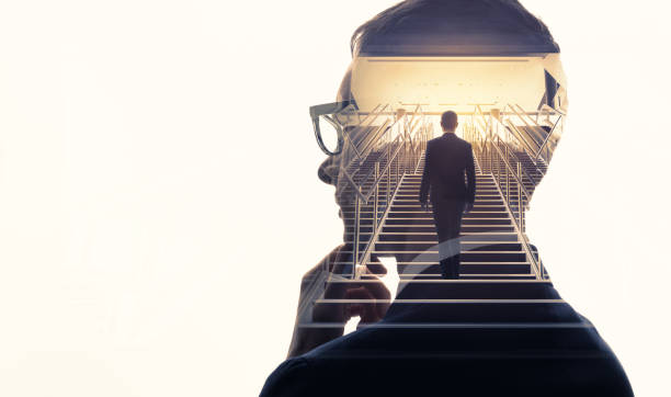 double exposure of a businessman and stairs. success of business concept. - conceptual vision imagens e fotografias de stock