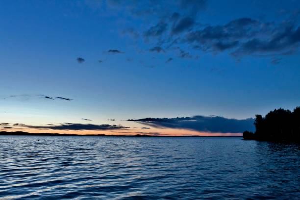 istock dark blue evening sky over the lake 994786564