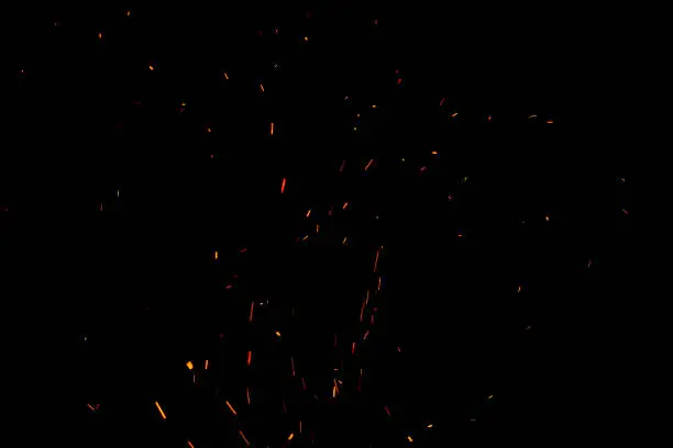 Photo of Sparks and fire on a black background