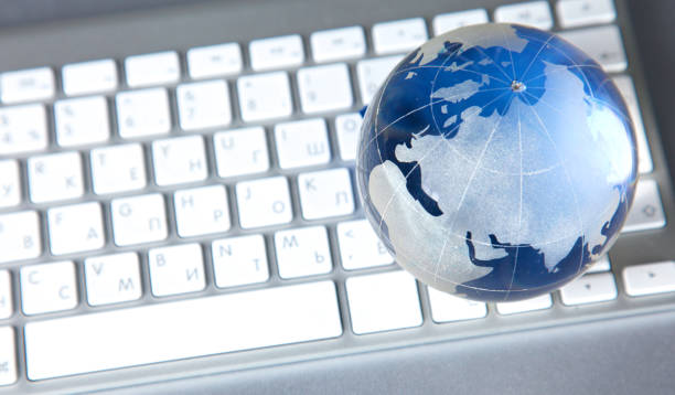 istock Cristal globe of the Earth on a Computer 994789532
