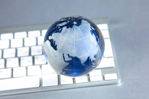 istock Cristal globe of the Earth on a Computer 994789562