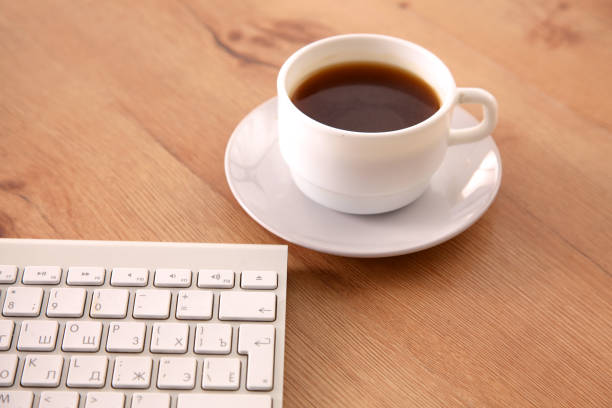 istock Office desk table with computer, supplies and coffee cup 994789740