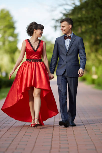 istock Elegant couple walking in the park 994792818