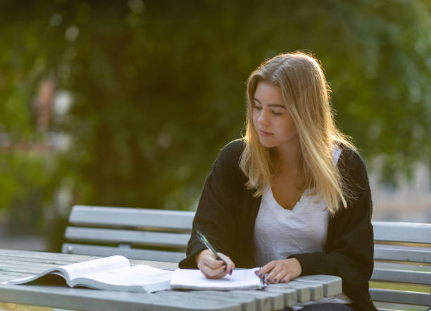 istock Girl studying in a park 994804124