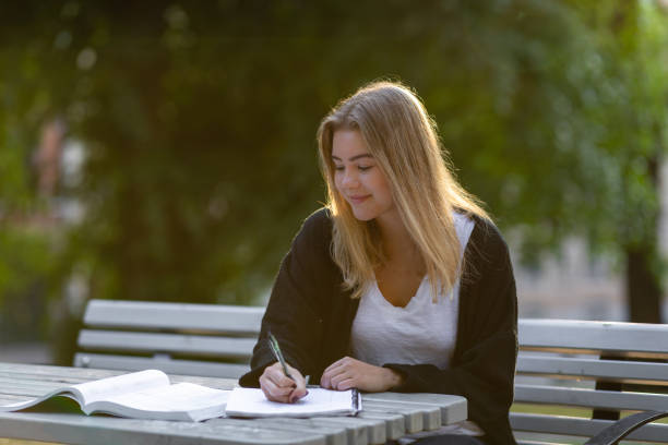 istock Girl studying in a park 994804142