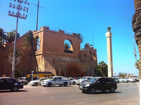 Tripoli, Libya - June 15, 2013: Traffic in Omar Mukhtar Street and Saraya Museums just opposite of the road.