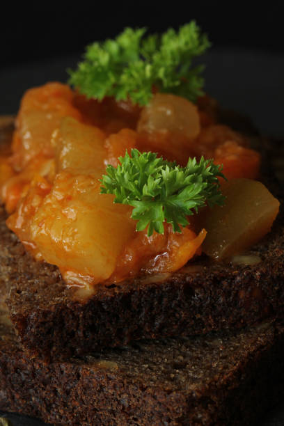 istock Canapes from a vegetarian ragout (stew) on a piece of bread 994807274