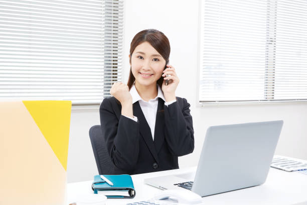istock smiling Asian woman guts pose gesture 994807440
