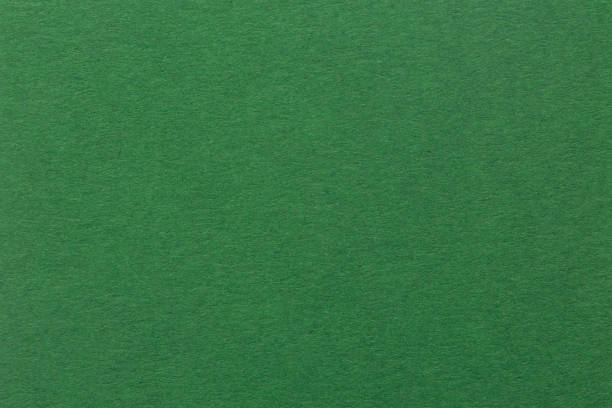 istock Textured dark green paper as background 994807606