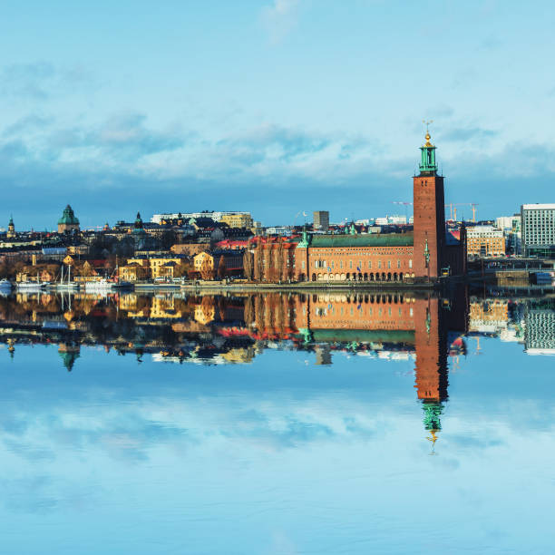 The City Hall, Stockholm Stockholm City Hall, with its spire featuring the golden Three Crowns, is one of the most famous silhouettes in Stockholm, Sweden. kungsholmen town hall photos stock pictures, royalty-free photos & images