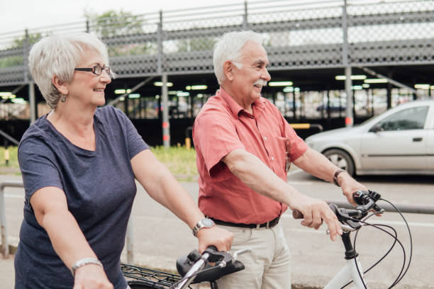 istock Senior couple standing by bicycles 994810356