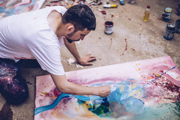 istock Young Man Painting Outdoors 994813742