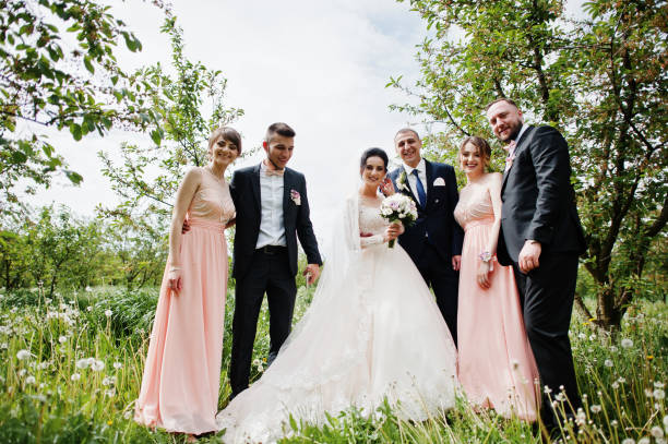 istock Groomsmen with bridesmaids and wedding couple 994813974