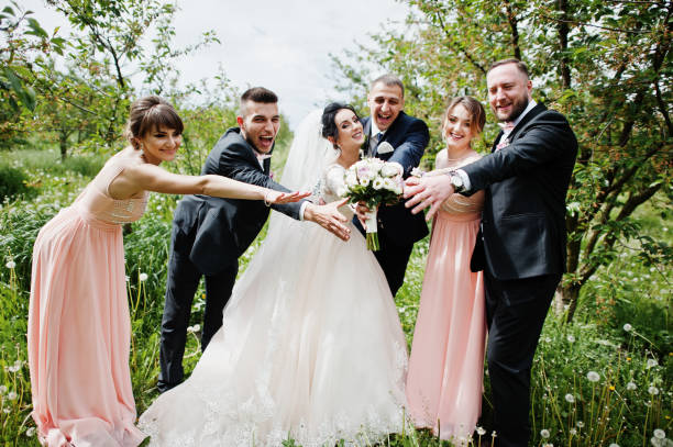 istock Groomsmen with bridesmaids and wedding couple 994814022