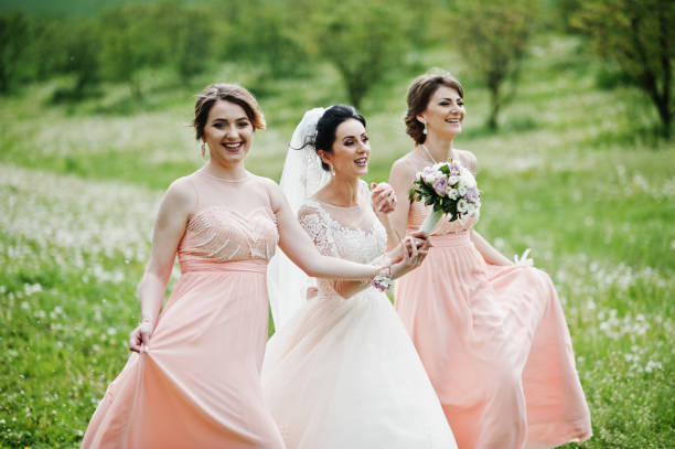 istock Beautiful bride posing with bridesmaids 994814374