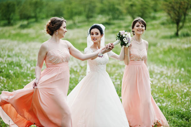 istock Beautiful bride posing with bridesmaids 994814378