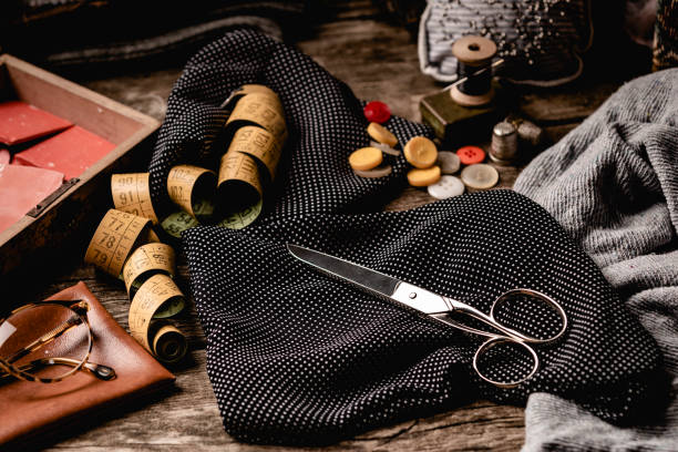 istock Retro sewing set on rough wooden table 994820674