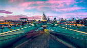 St Pauls Cathedral and Millennium bridge at dusk in London, UK.