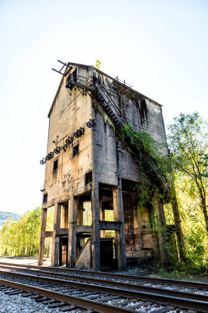 istock Abandoned retro vintage concrete loading receiving terminal building exterior in Thurmond, West Virginia ghost town with decaying structure walls, windows, railroad 994823648
