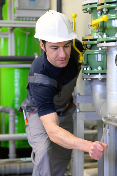 istock industrial worker repairs machines and equipment in a refinery 994834860