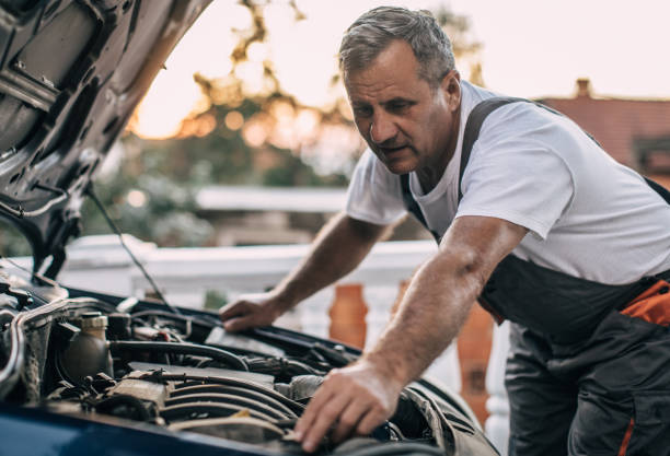 istock Mechanic repairing car 994841230