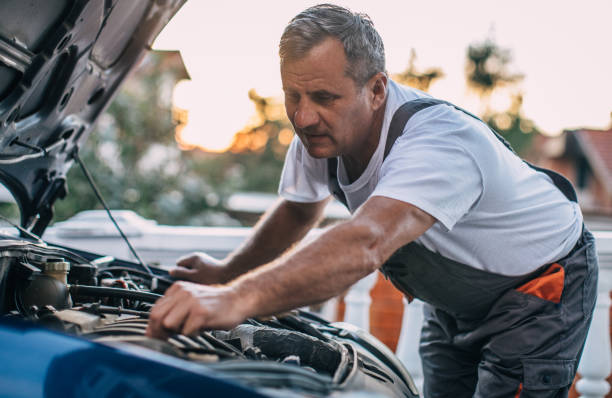 istock Mechanic repairing car 994841326
