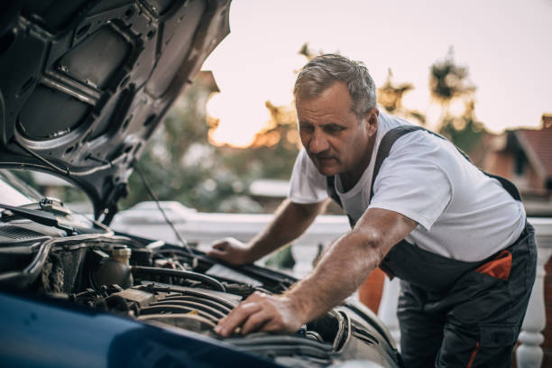 istock Mechanic repairing car 994841470