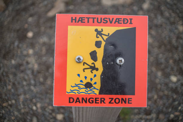 istock Warning sign at waterfalls in Iceland, overcast day 994841936