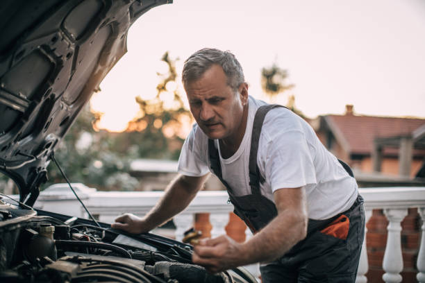 istock Mechanic repairing car 994841976