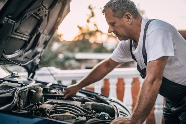 istock Mechanic repairing car 994842148