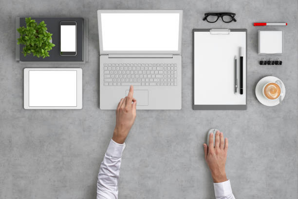 istock Man working on a laptop knolling overhead view 994842324