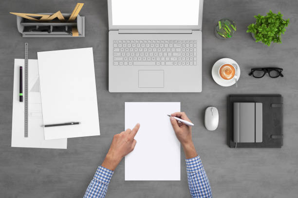 istock Architect designer writing on a blank piece of paper, copy space template - top view 994842334